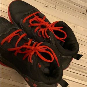 Black and red under armor basketball shoes